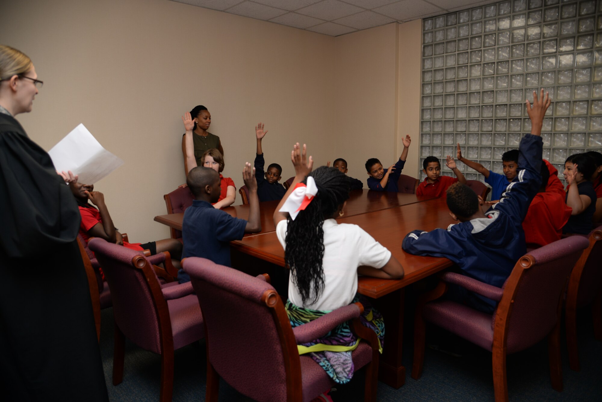 Ms. Erin Dixon acts as Cruella Deville pleading her case before jury members during a mock court-martial, U.S. versus Cruella Deville. The jurors deliberated before sentencing Deville May 3, 2016, at Joint Base Charleston, S.C. Students from Lambs Elementary acted as jurors, lawyers and bailiff during the mock trial. This was the second year that the JB Charleston legal team opened their courtroom doors for students to learn the military legal process in celebration of Law Day.