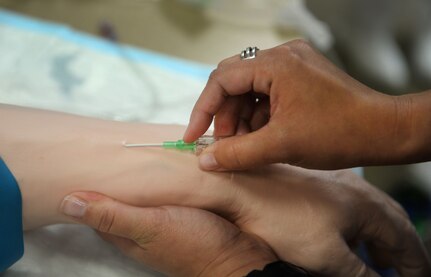 Participants in the 2016 Lowcountry Skills Fair practice inserting intravenous needles May 4, 2016 Joint Base Charleston - Weapons Station, S.C. The fair was created to showcase and improve the skillset of medical professionals throughout the local area. (U.S. Air Force photo/Senior Airman Ericka Engblom)