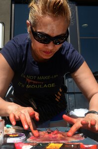 U.S. Air Force Master Sgt. Caroline Bunce, 628th Aerospace Medical Squadron dental hygienist, practices the art of moulage during the 2016 Lowcountry Skills Fair May 4, 2016 at Joint Base Charleston - Weapons Station, S.C. The fair was created to showcase and improve the skillset of medical professionals throughout the local area. (U.S. Air Force photo/Senior Airman Ericka Engblom)