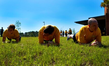 Sailors from the Naval Health Clinic Charleston perform planks during the 2016 LowCountry Skills Fair, May 4, 2016, at Joint Base Charleston - Naval Weapons Station, S.C. Participants of the skills fair included Sailors from NHCC, Airmen from the 628th Medical Group and Shaw Air Force Base and civilians from local community hospitals. (U.S. Air Force photo by Staff Sgt. Michael Battles)