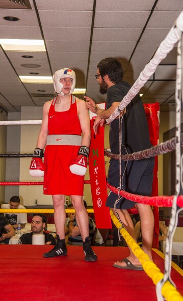Staff Sgt. Ryan Savage, 91st Security Forces Group evaluator, gets advice in his corner during his boxing match in Minot, N.D., May 7, 2016. Savage is a current state and regional champion and will compete for national champion in the 152 weight class soon. (U.S. Air Force photo/Airman 1st Class Christian Sullivan)