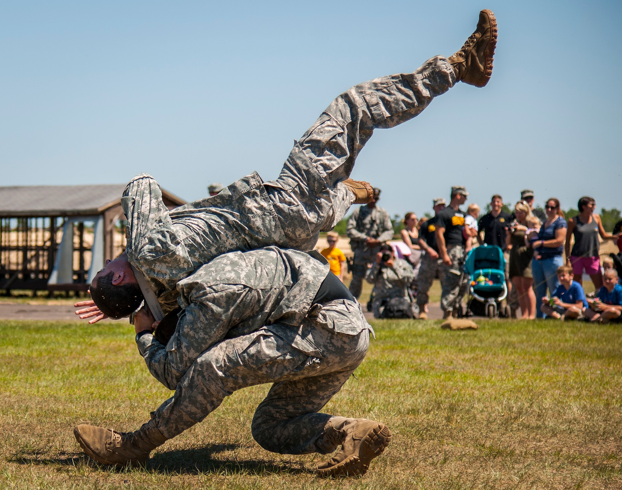 Soldiers demonstrate hand-to-hand combat during the 6th Ranger Training Battalion’s open house event May 7 at Eglin Air Force Base, Fla.  The event was a chance for the public to learn how Rangers train and operate. The event displays showed equipment, weapons, a reptile zoo, face painting and weapon firing among others. The demonstrations showed off hand-to-hand combat, a parachute jump, snake show, and Rangers in action. (U.S. Air Force photo/Samuel King Jr.)