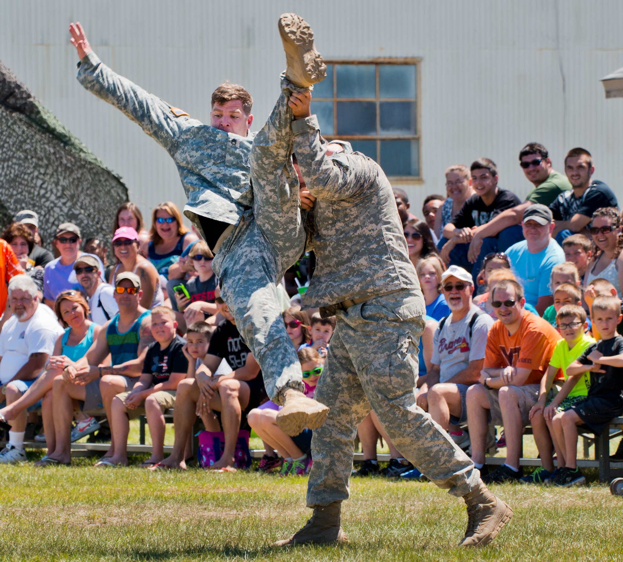 Soldiers demonstrate hand-to-hand combat during the 6th Ranger Training Battalion’s open house event May 7 at Eglin Air Force Base, Fla.  The event was a chance for the public to learn how Rangers train and operate. The event displays showed equipment, weapons, a reptile zoo, face painting and weapon firing among others. The demonstrations showed off hand-to-hand combat, a parachute jump, snake show, and Rangers in action. (U.S. Air Force photo/Samuel King Jr.)