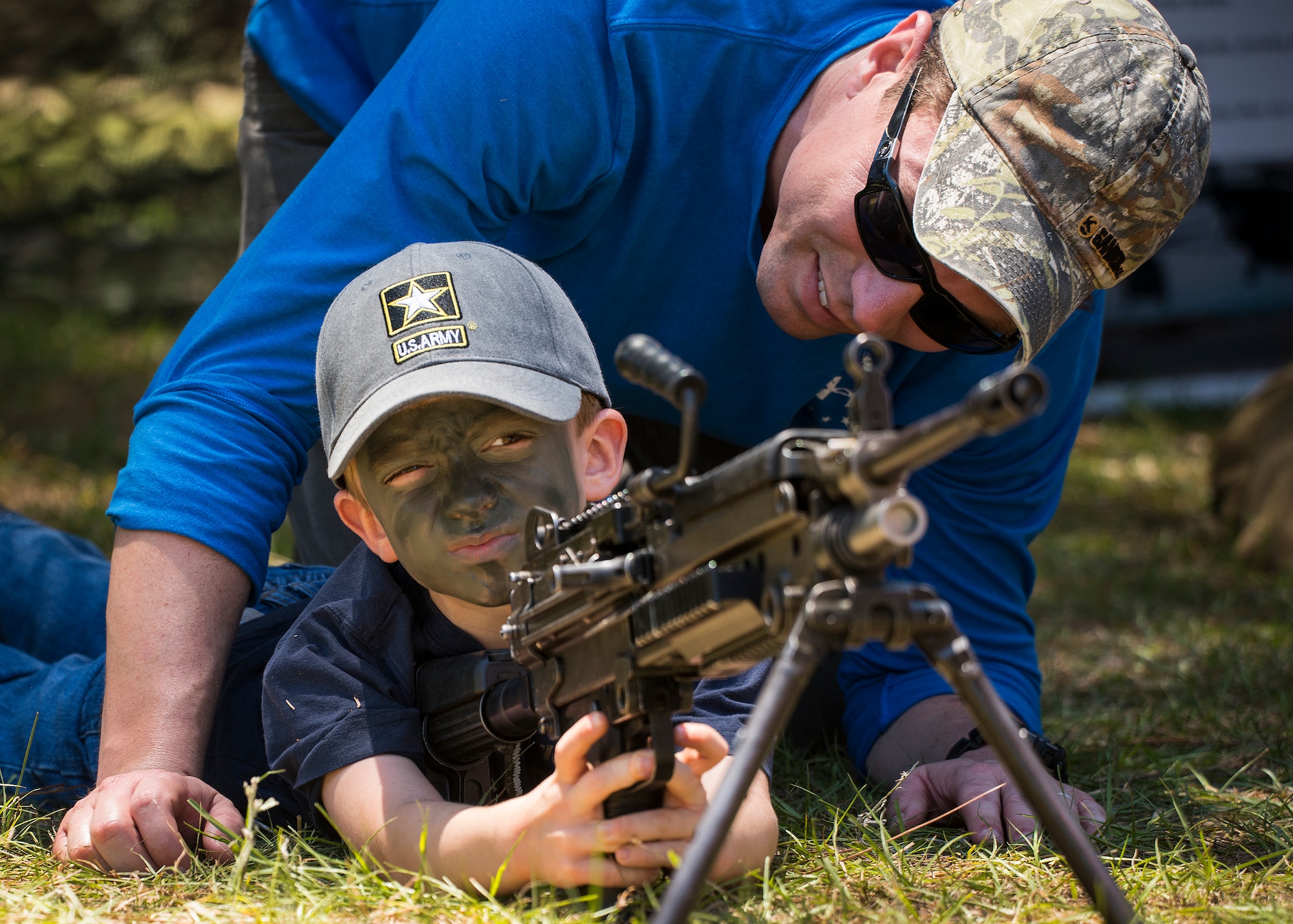 Liam Howard, age 5, aims a machine gun downrange during the 6th Ranger Training Battalion’s open house event May 7 at Eglin Air Force Base, Fla.  The event was a chance for the public to learn how Rangers train and operate. The event displays showed equipment, weapons, a reptile zoo, face painting and weapon firing among others. The demonstrations showed off hand-to-hand combat, a parachute jump, snake show, and Rangers in action. (U.S. Air Force photo/Samuel King Jr.)