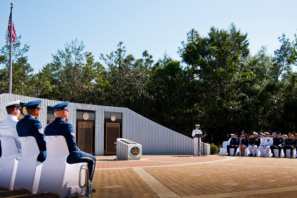 Capt. Charles Andrews, the Navy Explosive Ordnance Disposal School commandant, speaks to the crowd of approximately 500 people at the 47th Annual EOD Memorial Service at the Kauffman EOD Training Complex at Eglin Air Force Base, Fla., May 7. Names of recent fallen and past EOD technicians are added to the memorial wall during a ceremony each year.  The Army, Marines and Navy added six new names this year. The all-service total now stands at 320. (U.S. Air Force photo/ Samuel King Jr.)