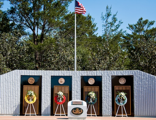 Wreaths are placed by the list of names of fallen explosive ordnance disposal technicians from each service at the 47th Annual EOD Memorial Service at the Kauffman EOD Training Complex at Eglin Air Force Base, Fla., May 7. Names of recent fallen and past EOD technicians are added to the memorial wall each year.  The Army, Marines and Navy added six new names this year. The all-service total now stands at 320. (U.S. Air Force photo/ Samuel King Jr.)