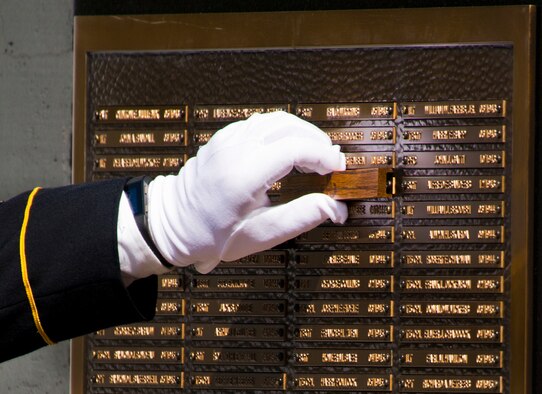 Another Soldier’s name is unveiled at the 47th Annual Explosive Ordnance Disposal Memorial Service at the Kauffman EOD Training Complex at Eglin Air Force Base, Fla., May 7. Names of recent fallen and past EOD technicians are added to the memorial wall during the ceremony each year.  The Army, Marines and Navy added six new names this year. The all-service total now stands at 320. (U.S. Air Force photo/ Samuel King Jr.)