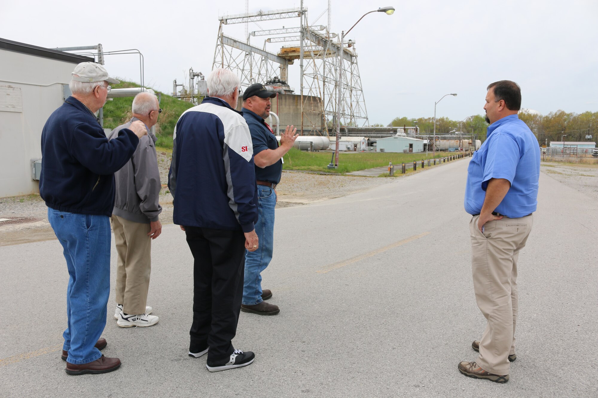 Butch Welch, second from right, outside machinist for the J-6 Large Rocket Motor Test Facility, shows his visitors the infrastructure used in running some of the test facilities at AEDC April 13, 2016. Welch invited the men to the base to see the firing of a Minuteman Stage II rocket motor. Pictured left to right are Donald Brodes, Charles Bolick, Leonard Ohlsson, Butch Welch and David Dailey.  (U.S. Air Force photo/Deidre Ortiz)