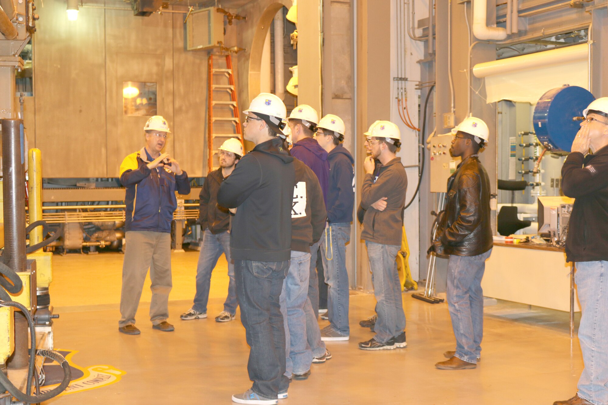 Students with Tau Beta Pi, the Engineering Honor Society, of Tennessee Technological University visited AEDC on April 8 to tour the test areas and learn from engineers about what goes into running one of world’s largest, most complex collection of flight simulation test facilities. Pictured is John Kelly, left, the AEDC Pratt & Whitney F135 engine test manager, talking to the group in the Sea Level engine test cell. (U.S. Air Force photo/Holly Peterson)
