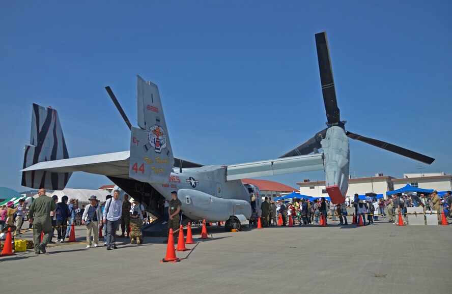 Spectators at the 2016 Friendship Day walk through an MV-22 Osprey static display at Marine Corps Air Station Iwakuni, Japan, May 5, 2016. Since 1973, MCAS Iwakuni has conducted a single-day air show and open house specifically designed to foster positive relationships between the air station and Japan. (U.S. Air Force photo by Senior Airman David Owsianka/Released)