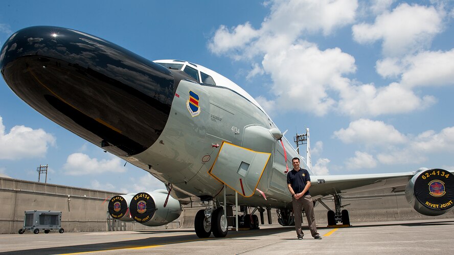Curtis Towne, Department of Defense civilian employee, stands next to an RC-135W Rivet Joint April 29, 2016, at Kadena Air Base, Japan. The RC-135W is assigned to the 82nd Reconnaissance Squadron, but is used for missions with the 390th Intelligence Squadron. Towne was assigned to the 390th Intelligence Squadron in 2001 when he was detained for 12 days by the People’s Republic of China following a mid-air collision with a Chinese jet. (U.S. Air Force photo by Airman 1st Class Lynette M. Rolen)