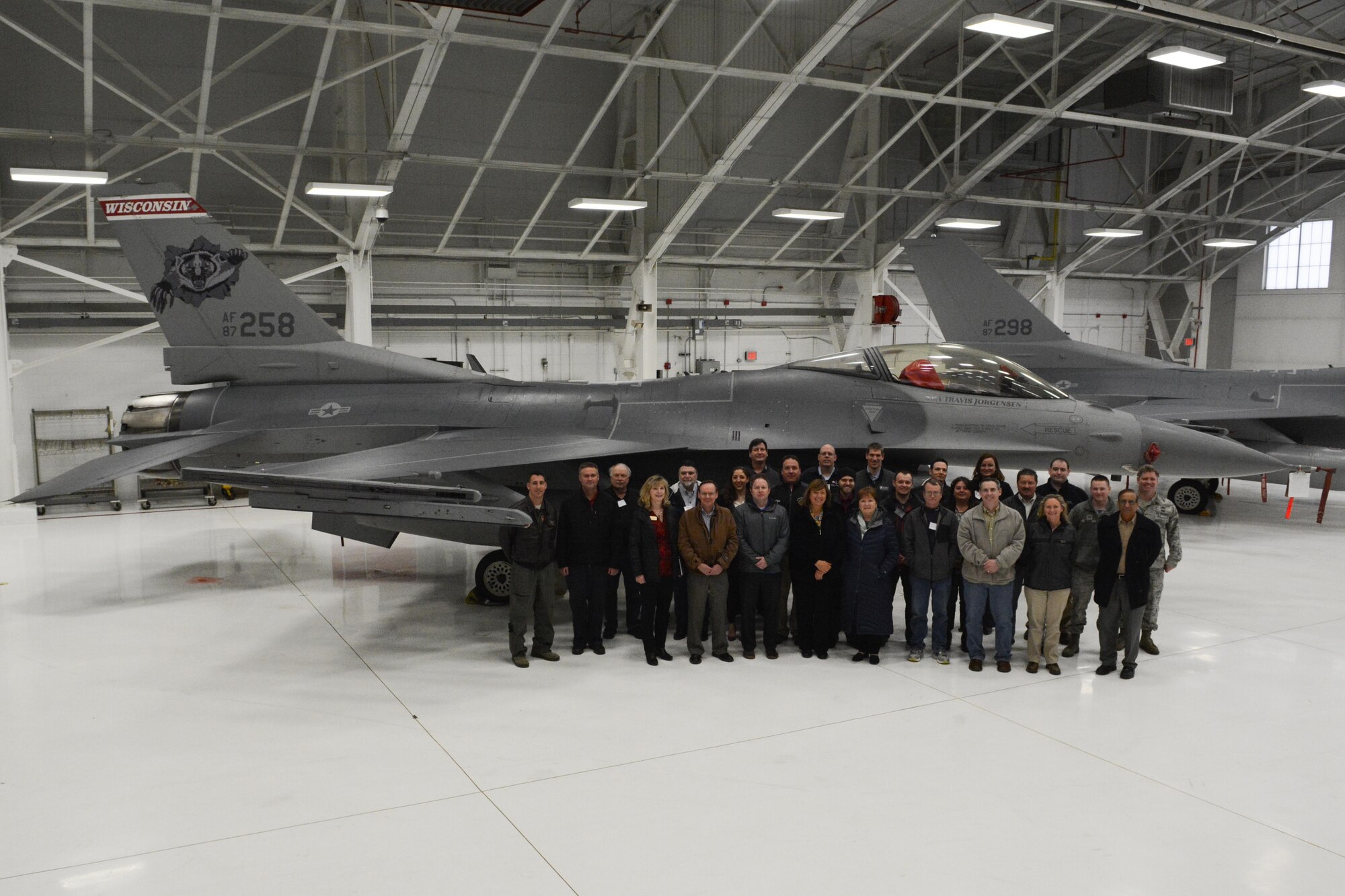 Members of the American Society of Safety Engineers region V posed in front of a 115th Fighter Wing F-16 Fighting Falcon in Hangar 406 at Truax Field, Madison, Wis., April 7, 2016. The 115 FW hosted the ASSE’s annual operating committee meeting on base. Each year the meeting is held at a different location, giving members an opportunity to tour various companies and facilities. (U.S. Air National Guard photo by Staff Sgt. Andrea F. Rhode)