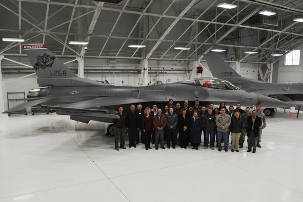 Members of the American Society of Safety Engineers region V posed in front of a 115th Fighter Wing F-16 Fighting Falcon in Hangar 406 at Truax Field, Madison, Wis., April 7, 2016. The 115 FW hosted the ASSE’s annual operating committee meeting on base. Each year the meeting is held at a different location, giving members an opportunity to tour various companies and facilities. (U.S. Air National Guard photo by Staff Sgt. Andrea F. Rhode)