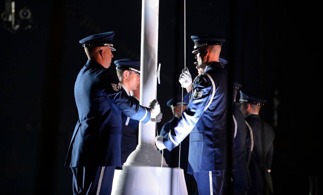 The Patrick Air Force Base, Fla. honor guard raises the Invictus Flag at the Opening Ceremony of the Invictus Games 2016 in Orlando, Fla. May 8, 2016. The Invictus Games are composed of 14 nations, over 500 military competitors, competing in 10 sporting events May 8-12, 2016. (U.S. Air Force photo by Staff Sgt. Carlin Leslie/Released)