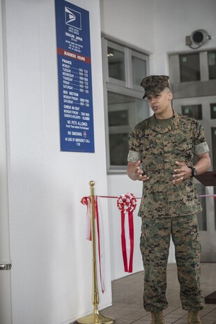 Chief Warrant Officer Jonathan Solla, postal officer with Headquarters and Headquarters Squadron, gives his opening remarks during  the grand opening ceremony for the new south side post office on Marine Corps Air Station Iwakuni, Japan, May 9, 2016. The new post office will start delivering and sending mail on opening day. (U.S. Marine Corps photo by Cpl. Nathan Wicks/Released) 