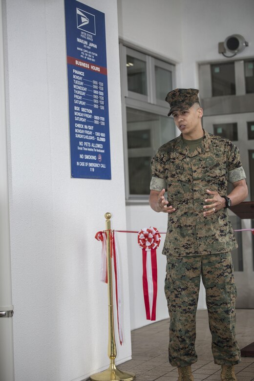 Chief Warrant Officer Jonathan Solla, postal officer with Headquarters and Headquarters Squadron, gives his opening remarks during  the grand opening ceremony for the new south side post office on Marine Corps Air Station Iwakuni, Japan, May 9, 2016. The new post office will start delivering and sending mail on opening day. (U.S. Marine Corps photo by Cpl. Nathan Wicks/Released) 