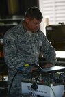 Staff Sgt. Jeffrey Snuffin, 51st Munitions Squadron conventional maintenance crew chief, reads a technical order to his crew before working on several Joint Direct Attack Munitions, May 9, 2016, at Osan Air Base, Republic of Korea. Snuffin was the lead technician in a group of Airmen updating the guidance firmware on several JDAMS as part of Exercise Beverly Herd 16-01. (U.S. Air Force photo by Senior Airman Victor J. Caputo/Released)