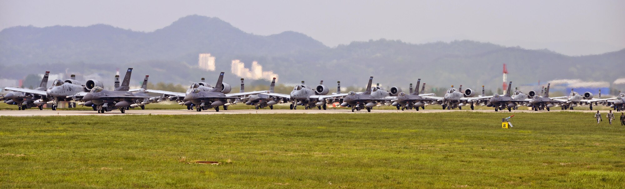 A-10 Thunderbolt II and F-16 Fighting Falcon fighter aircraft perform an 'Elephant Walk' on the runway this week during Exercise Beverly Herd 16-01 at Osan Air Base, Republic of Korea.  The Elephant Walk was a demonstration of U.S. Air Force capabilities and strength and showcases the wing's ability to generate combat airpower in an expedient manner in order to respond to simulated contingency operations. The A-10 Thunderbolt II aircraft are the 25th Fighter Squadron "Draggins" and the F-16 Fighting Falcon aircraft are the 36th Fighter Squadron "Friends" from the 51st Fighter Wing, Osan AB, ROK; the additional F-16 aircraft are the 179th Fighter Squadron "Bulldogs" from the 148th Fighter Wing out of Duluth Air National Guard Base, Minnesota. (U.S. Air Force photo by Tech. Sgt. Travis Edwards/Released) 