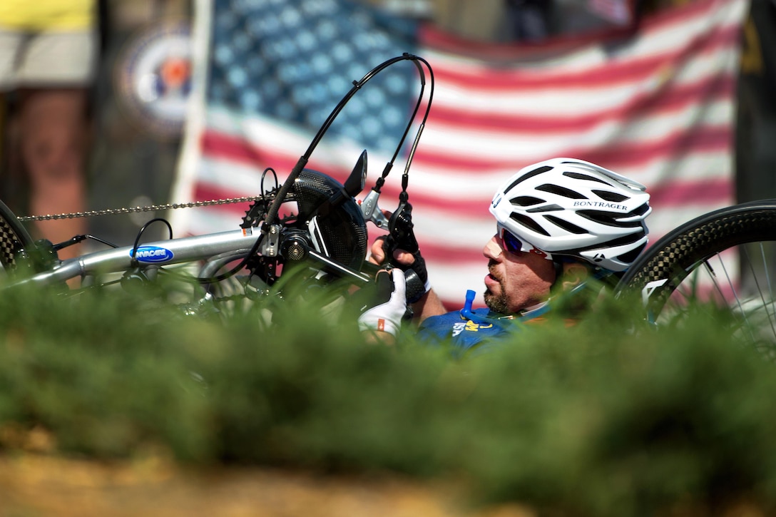 Navy veteran Steve Simmons, a Navy veteran, powers his hand cycle during the 2016 Invictus Games in Orlando, Fla., May 9, 2016. DoD photo by EJ Hersom