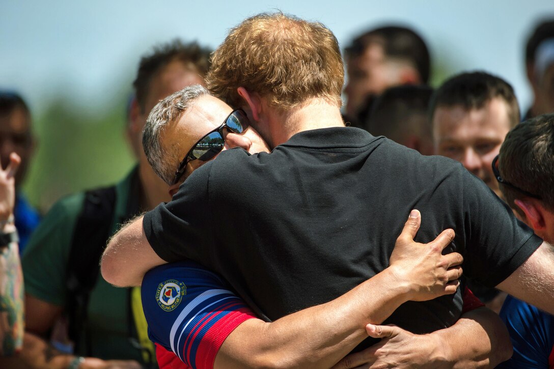Ivan Castro, a U.S. team member, hugs Prince Harry at the Invictus Games 2016 in Orlando, Fla., May 9, 2016. DoD photo by EJ Hersom