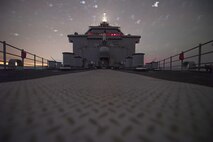 (May 1, 2016) The sun sets behind the dock landing ship USS Harpers Ferry (LSD 49). Harpers Ferry is part of the Boxer Amphibious Ready Group and, with the embarked 13th Marine Expeditionary Unit, is deployed in support of maritime security operations and theater security cooperation efforts in the U.S. 5th Fleet area of operations.
