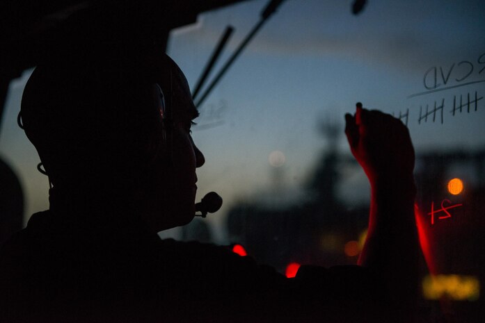 (May 6, 2016) Electronics Technician 3rd Class William Bozak logs cargo in the pilot house of guided-missile destroyer USS Gonzalez (DDG 66) during a replenishment-at-sea with fleet-replenishment oiler USNS Richard E. Byrd (T-AKE 4). Gonzalez is currently operating with the Boxer Amphibious Ready Group in support of maritime security operations and theater security cooperation efforts in the U.S. 5th Fleet area of operations.