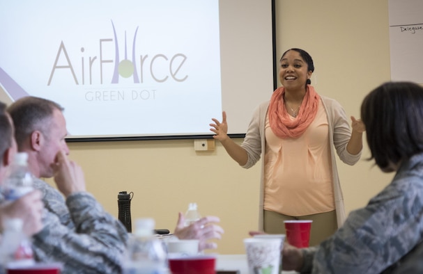 Staff Sgt. Sylvia Smith, Air Force Green Dot instructor, introduces the Green Dot program at the start of leadership training April 19, 2016, at Mountain Home Air Force Base, Idaho. Green Dot is a program designed to reduce interpersonal violence through cultural change. (U.S. Air Force photo by Tech. Sgt. Samuel Morse/Released)