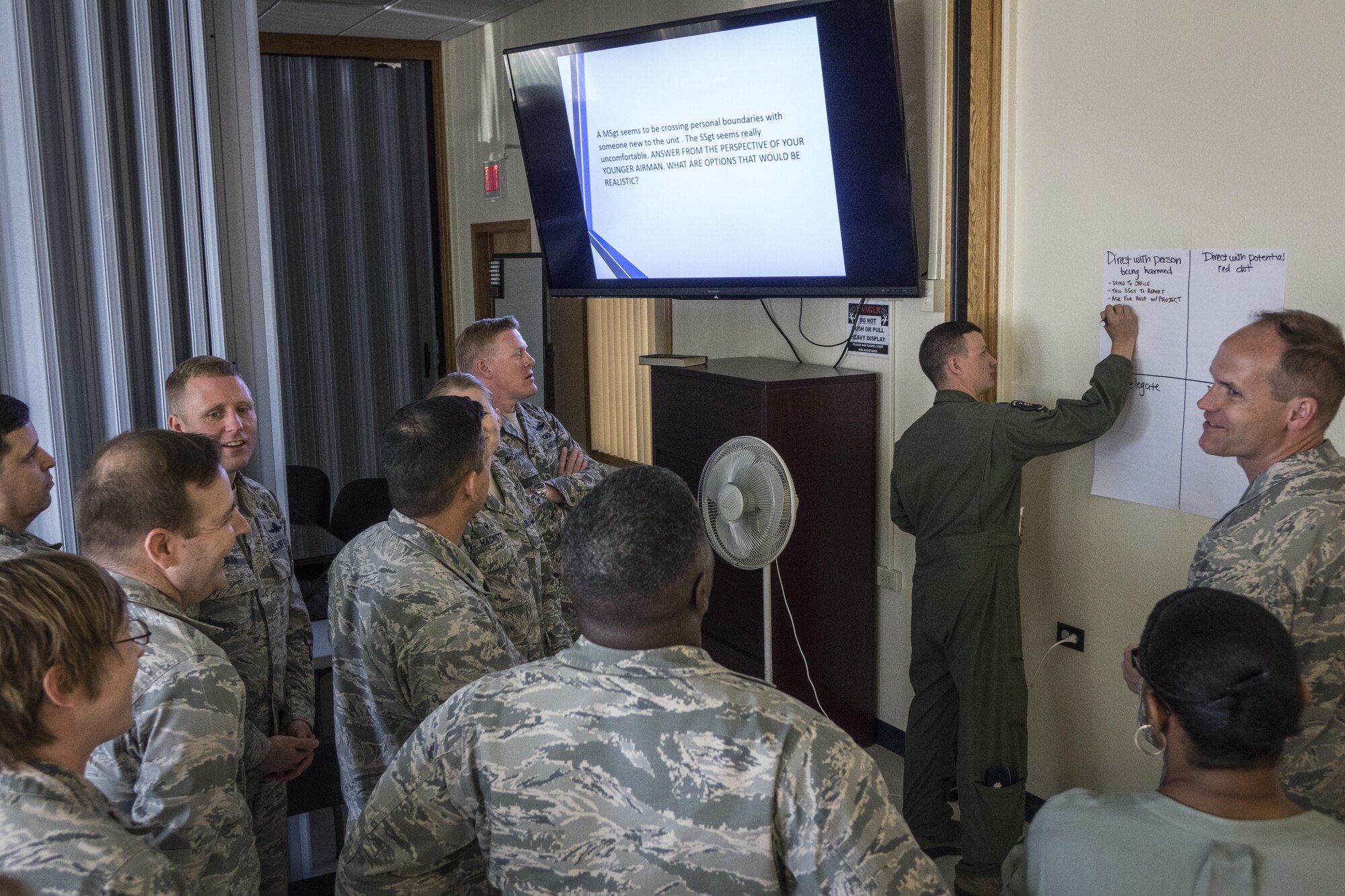 Students attending Green Dot leadership training brainstorm ideas of how to intervene in a scenario April 19, 2016, at Mountain Home Air Force Base, Idaho. The training encourages students to think creatively to solve problems that might make them uncomfortable. (U.S. Air Force photo by Tech. Sgt. Samuel Morse/Released)