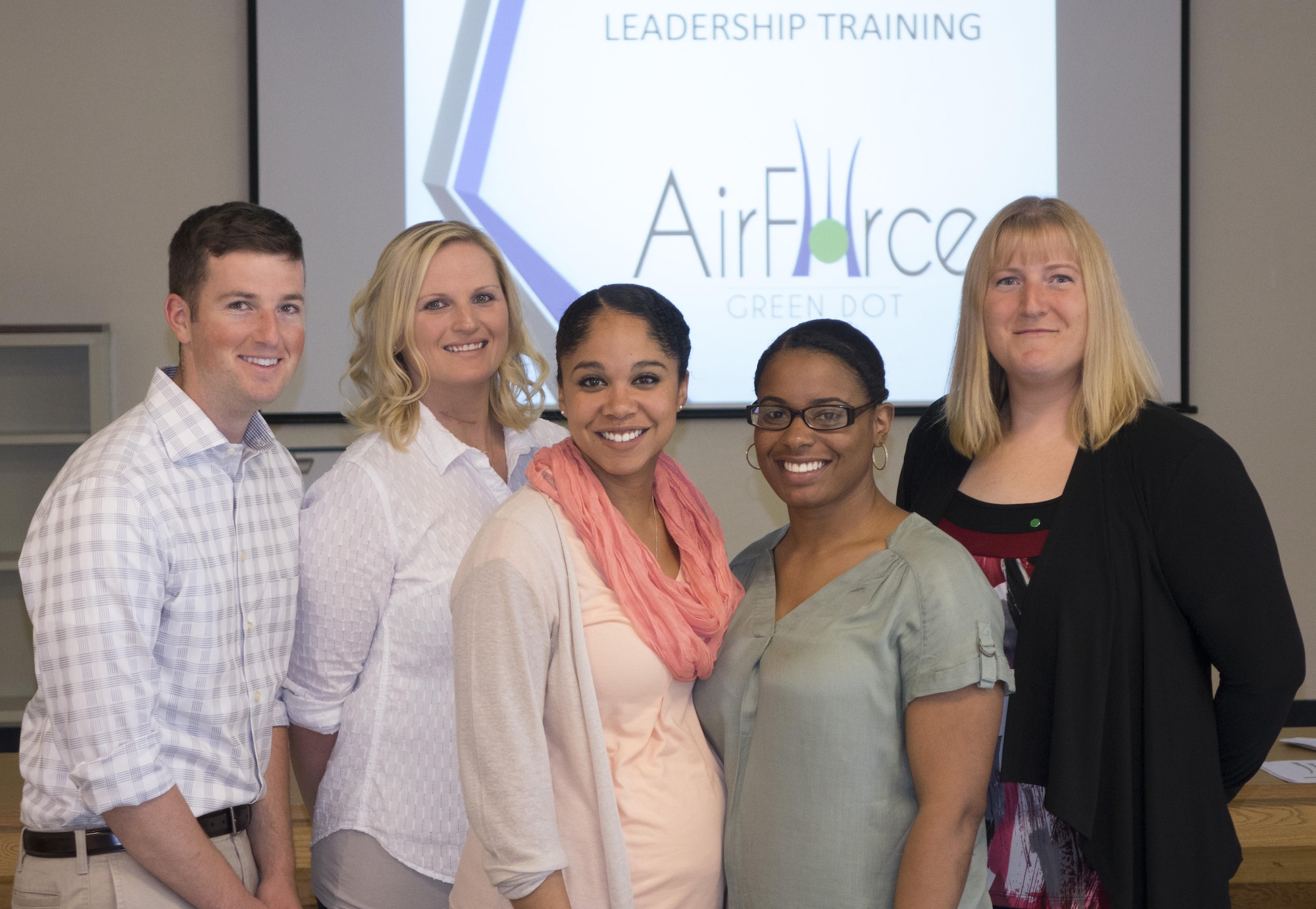 From the left: 2nd Lt. Chase Barnes, Tech. Sgt. Kori Hillman, Staff Sgt. Sylvia Smith, Staff Sgt. Shaquasia Grandy and Tech. Sgt. Tessa Holtz, Air Force Green Dot instructors, pose for a photo at Mountain Home Air Force Base, Idaho, April 19, 2016. Each instructor was selected from units around Mountain Home AFB and sent to be certified in the program. (U.S. Air Force photo by Tech. Sgt. Samuel Morse/Released)