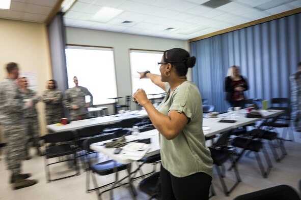 Staff Sgt. Shaquasia Grandy, Air Force Green Dot instructor, calls on groups to share their ideas at Mountain Home Air Force Base, Idaho. Despite being military members, the instructors were trained to wear civilian clothes, go by their first names and use their personalities to make the learning environment more fun and inviting to participants. (U.S. Air Force photo by Tech. Sgt. Samuel Morse/Released)