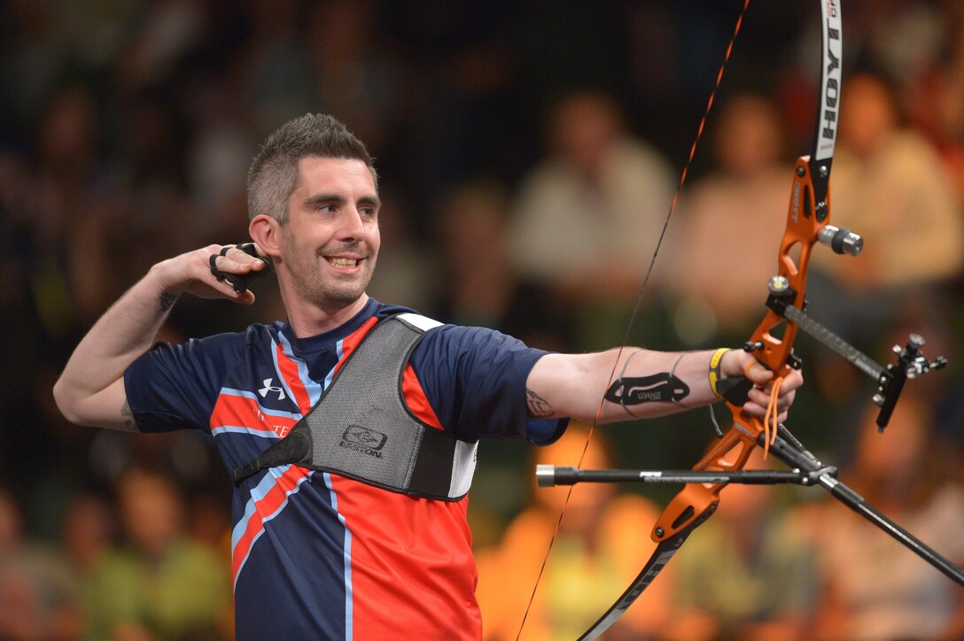 Great Britain’s Angelito Barbierato releases an arrow as he competes in the archery finals during the 2016 Invictus Games in Orlando, Fla., May 9, 2016. Army photo by Staff Sgt. Alex Manne