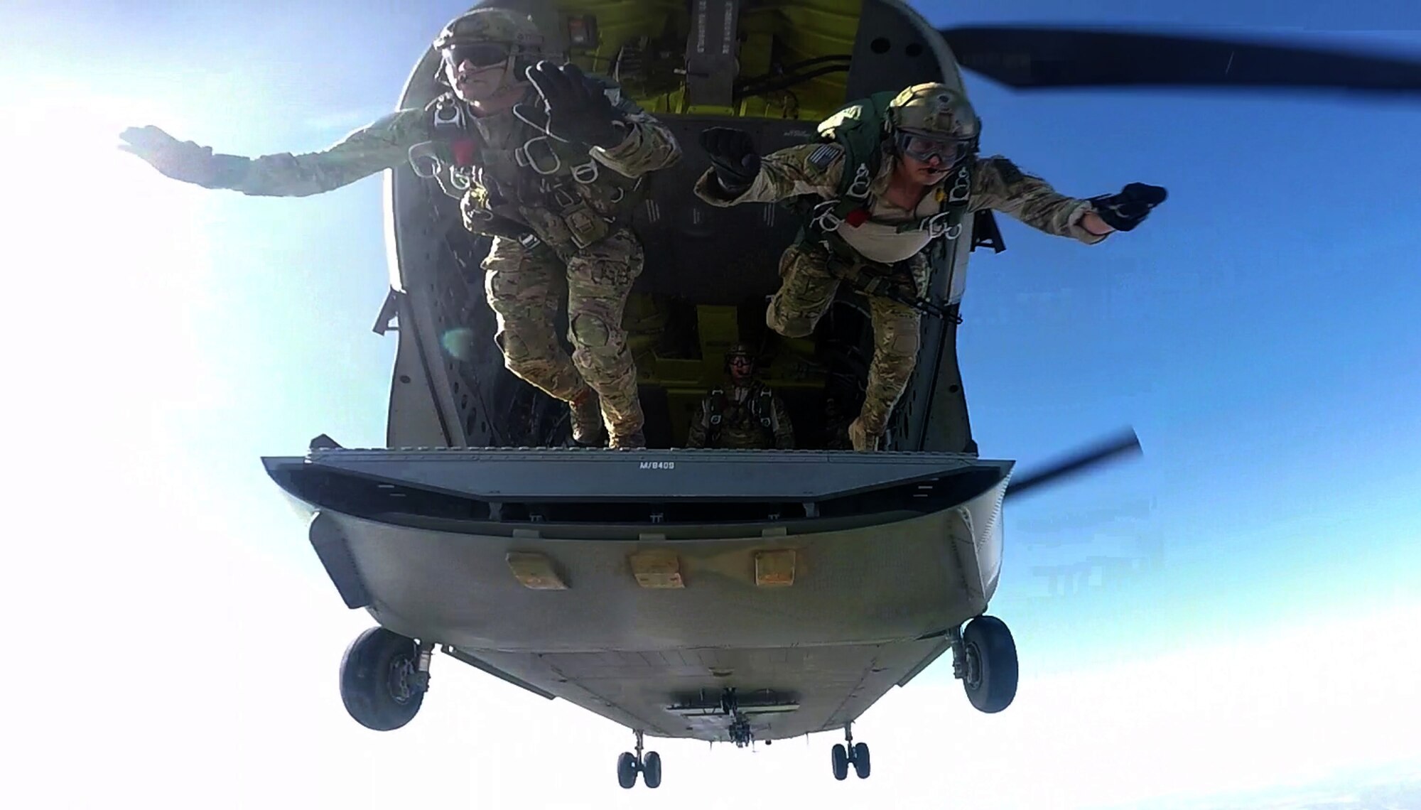 U.S. Air Force Special Tactics Airmen assigned to the 24th Special Operations Wing conduct a freefall jump from a U.S. Army CH-47 Chinook assigned to 5th Battalion, 159th Aviation Regiment, Fort Eustis, Va., during Emerald Warrior 16 over Eglin Range, Fla., May 7, 2016. Emerald Warrior is a U.S. Special Operation Command-sponsored mission rehearsal exercise during which joint special operations forces train to respond to real and emerging worldwide threats. (U.S. Air Force still frame from video by Tech. Sgt. Gregory Brook)
