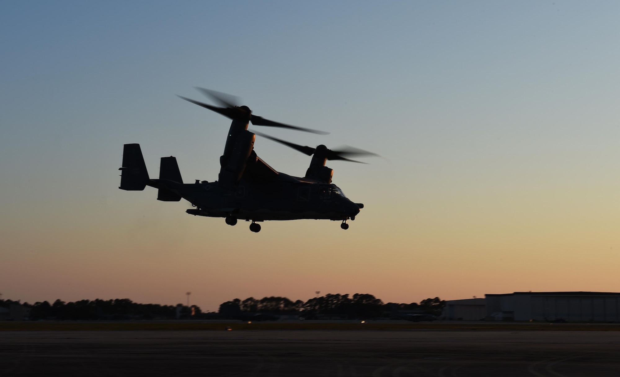A U.S. Air Force CV-22 Osprey assigned to the 8th Special Operations Squadron hovers over the flightline at Hurlburt Field, Fla., May 7, 2016, during Emerald Warrior 16. Emerald Warrior is a U.S. Special Operations Command-sponsored mission rehearsal exercise during which joint special operations forces train to respond to real and emerging worldwide threats. (U.S. Air Force photo by Senior Airman Jasmonet Jackson)