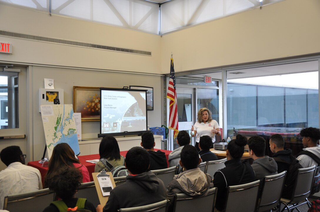 Lisa Baron, project manager, USACE, New York District, gives a presentation to students during a recent Earth Day event, focusing on the diverse range of missions/projects being performed by the U.S. Army Corps of Engineers.