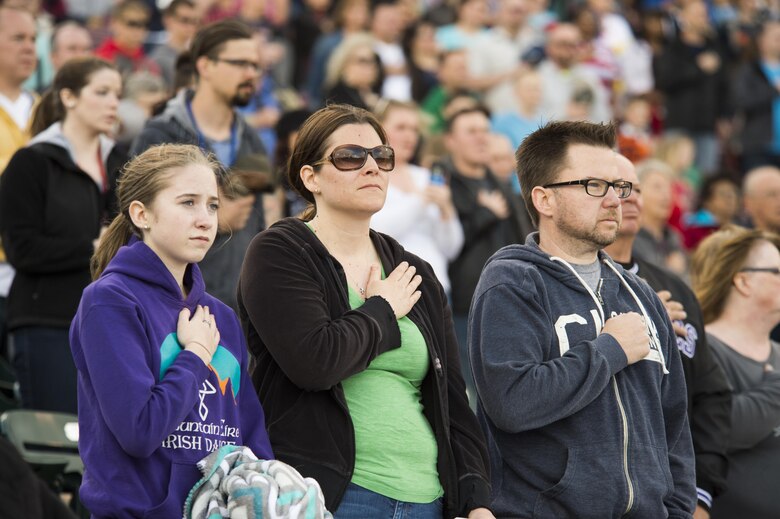 Sky Sox Spectators honor the U.S. flag during the national anthem at Security Service Field in Colorado Springs, Colorado, Friday, May 6, 2016. Airmen from Schriever and Peterson Air Force Bases, Cheyenne Mountain Air Force Station and U.S. Air Force Academy participated in the event as part of the Sky Sox’s Air Force Appreciation Night. (U.S. Air Force photo/Tech. Sgt. Julius Delos Reyes)
