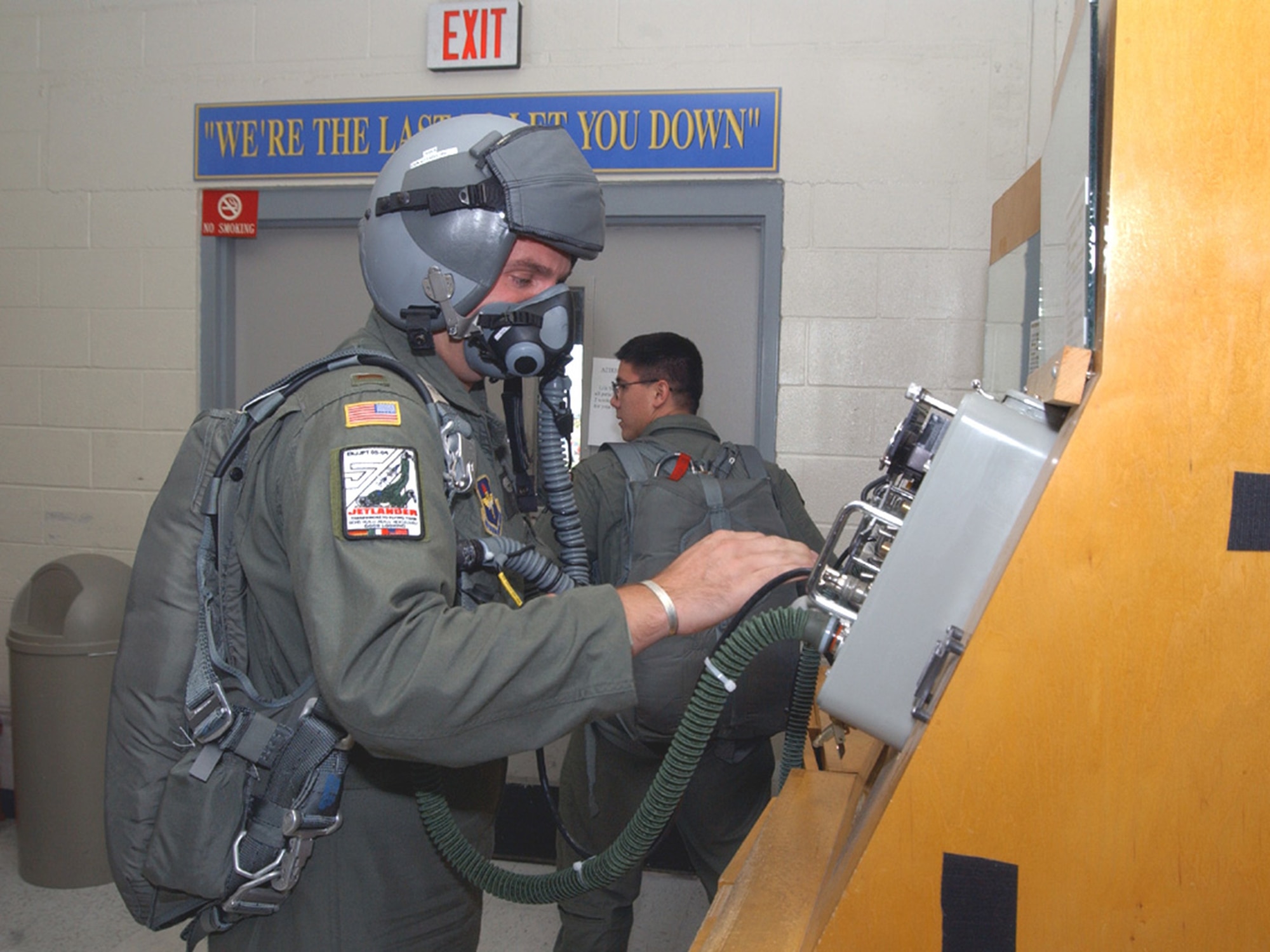 A Euro-NATO Joint Jet Pilot Training student pilot runs a safety check on his oxygen equipment as part of his pre-flight process at Sheppard Air Force Base, Texas. This equipment, which provides oxygen to the pilot, helps prevent the effects of hypoxia and carbon monoxide poisoning while flying at high altitudes. (U.S. Air Force Photo/82nd Training Wing Public Affairs)