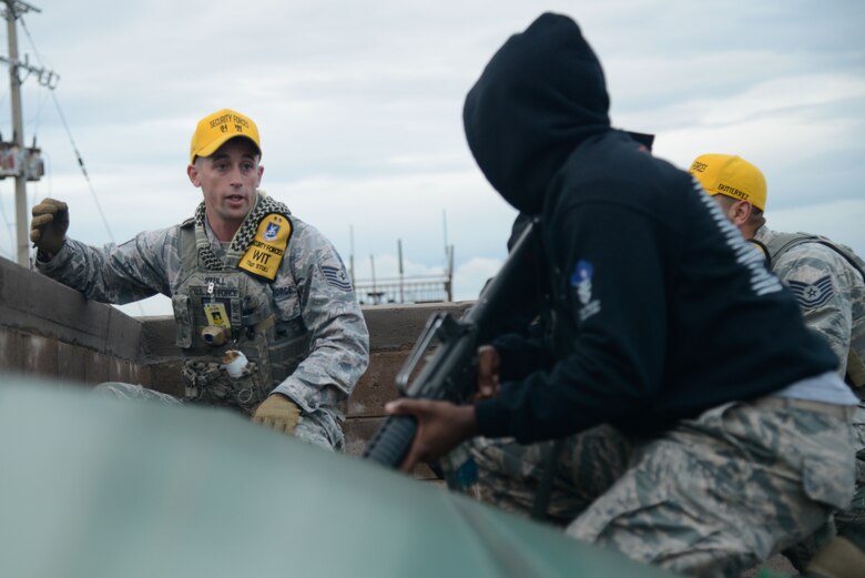 Tech. Sgt. Jeremy Stull, 51st Fighter Wing inspection team member, briefs simulated opposing forces members before an OPFOR scenario during Beverly Herd 16-01 May 10, 2016, at Osan Air Base, Republic of Korea. BH 16-01 is a week-long readiness exercise for the 51st FW which includes a plethora of scenarios like Chemical, Biological, Radioactive, and Nuclear response, active shooter and opposing forces. (U.S. Air Force photo by Senior Airman Dillian Bamman/Released) (U.S. Air Force photo by Senior Airman Dillian Bamman/Released)
