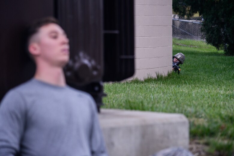 A fire team member from the 51st Security Forces Squadron simulates neutralizing an armed intruder during an opposing forces scenario forBeverly Herd 16-01 May 10, 2016, at Osan Air Base, Republic of Korea. BH 16-01 is a week-long readiness exercise for the 51st FW which includes a plethora of scenarios like Chemical, Biological, Radioactive, and Nuclear response, active shooter and opposing forces. (U.S. Air Force photo by Senior Airman Dillian Bamman/Released)