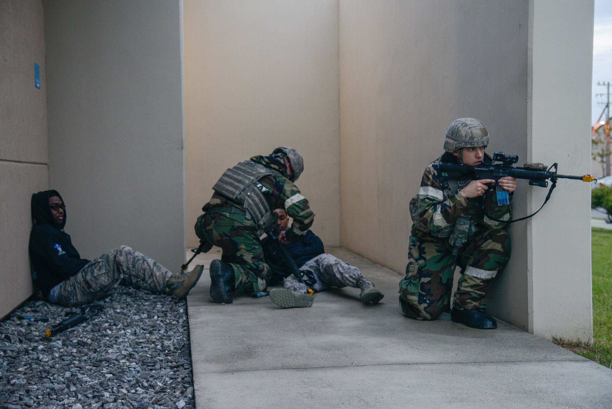 Fire team members from the 51st Security Forces Squadron immobilize simulated intruders during an opposing forces scenario for Beverly Herd 16-01 May 10, 2016, at Osan Air Base, Republic of Korea. BH 16-01 is a week-long readiness exercise for the 51st FW which includes a plethora of scenarios like Chemical, Biological, Radioactive, and Nuclear response, active shooter and opposing forces. (U.S. Air Force photo by Senior Airman Dillian Bamman/Released)