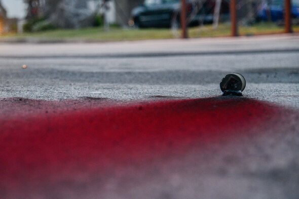 A can of colored smoke rests on the ground of an opposing forces scenario during Beverly Herd 16-01 May 10, 2016, at Osan Air Base, Republic of Korea. BH 16-01 is a week-long readiness exercise for the 51st Fighter Wing which includes a plethora of scenarios like Chemical, Biological, Radioactive, and Nuclear response, active shooter and opposing forces. (U.S. Air Force photo by Senior Airman Dillian Bamman/Released)