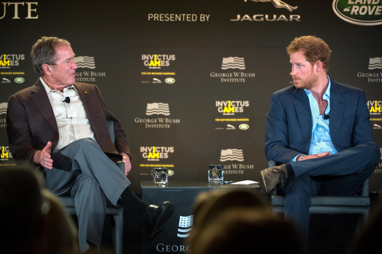 Former President George W. Bush and Britain’s Prince Harry discuss the topic of post-traumatic stress during the 2016 Invictus Games Symposium on Invisible Wounds in Orlando, Fla., May 8, 2016. DoD photo by EJ Hersom