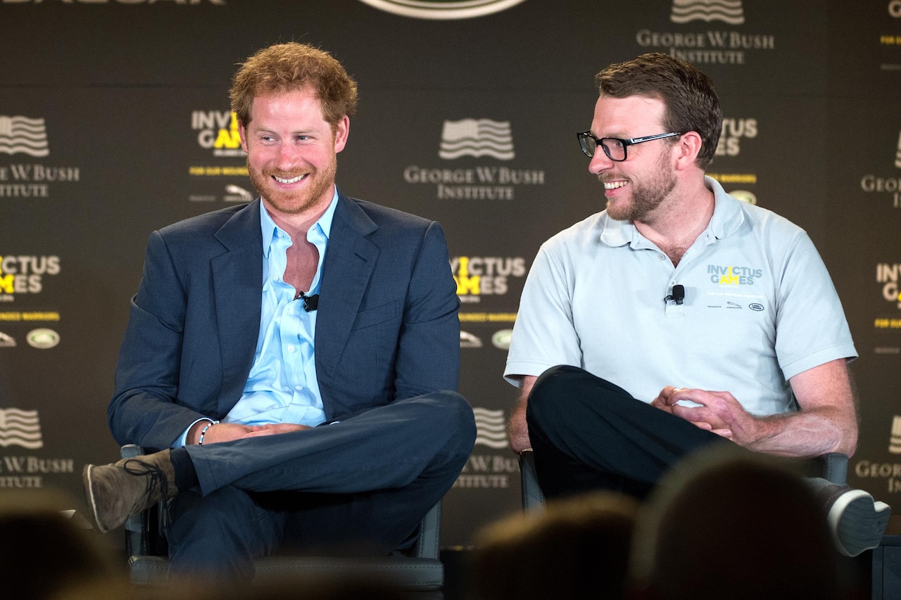 Britain’s Prince Harry and former Royal Marine and Invictus competitor John-James Chalmers react during the 2016 Invictus Games Symposium on Invisible Wounds in Orlando, Fla., May 8, 2016. DoD photo by EJ Hersom