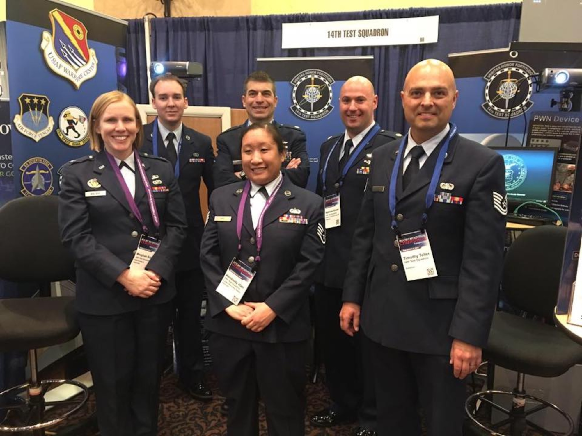 Members of the 14th Test Squadron manned a Cyber Exploitation booth demonstrating their unit's capabilities at the Armed Forces Communications and Electronics Association Cyberspace Symposium in Colorado Springs, Colorado. (Left to right) Capt. Meaghan Balser, Staff Sgt. John Marshall, Maj. Marc Weber, Staff Sgt. Kimberly Han, Maj. Matthew Shuter, Tech. Sgt. Timothy Teller.