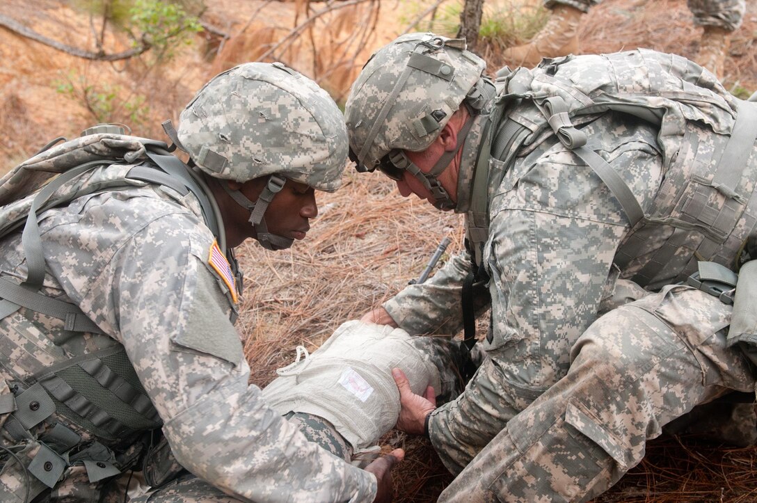 Army Spc. Georges Weeks, left, and Staff Sgt. Travis McCorkendale participate in the combat lifesaver event during the 2016 Army Reserve Best Warrior Competition at Fort Bragg, N.C., May 5, 2016. Weeks is assigned to the 80th Training Command and McCorkendale is assigned to the 416th Theater Engineer Command. Army photo by Sgt. Darryl L. Montgomery 