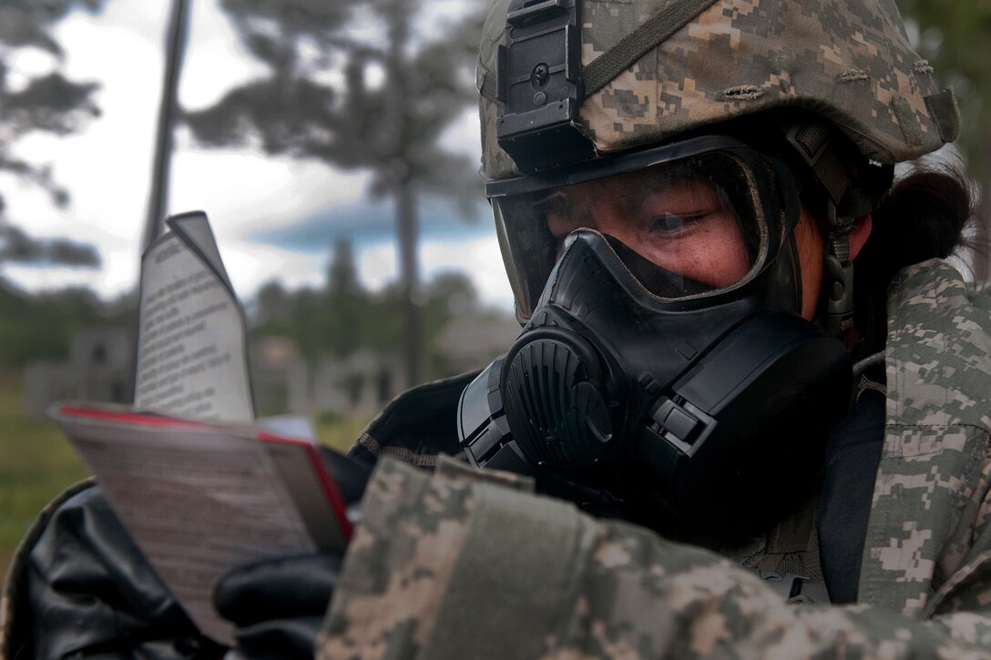 Army Spc. Kayla Bundy reads a chemical, biological, radiological and nuclear card during the 2016 Army Reserve Best Warrior Competition at Fort Bragg, N.C., May 5, 2016. Bundy is assigned to the 108th Training Command. Army photo by Sgt. Darryl L. Montgomery