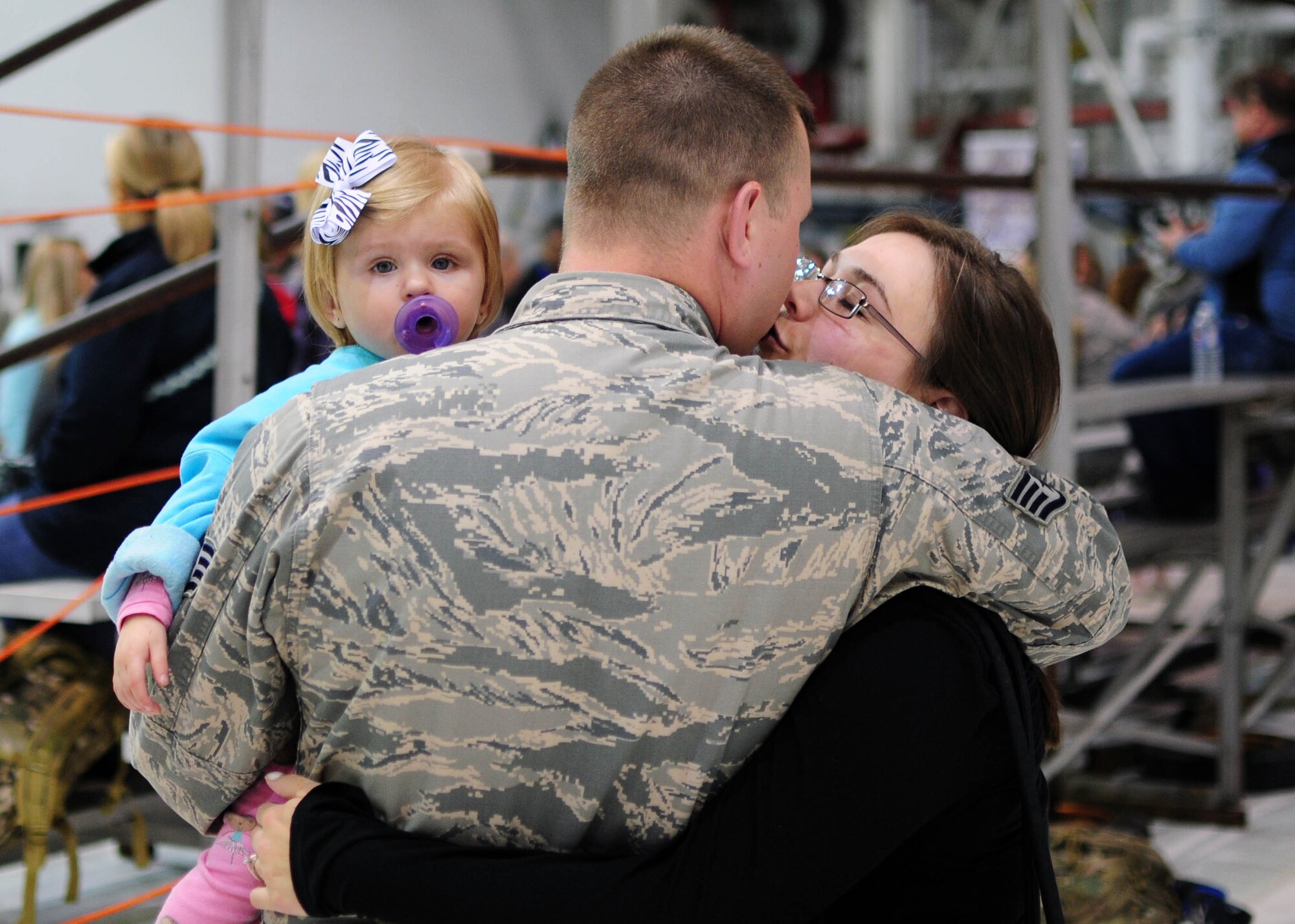 Family members share an embrace at Niagara Falls Air Reserve Station prior to deployment on May 7, 2016. The deployment will take these Airmen to Quatar in support of Operation Inherent Resolve. (U.S. Air Force photo by Staff Sgt. Richard D. Mekkri/released)