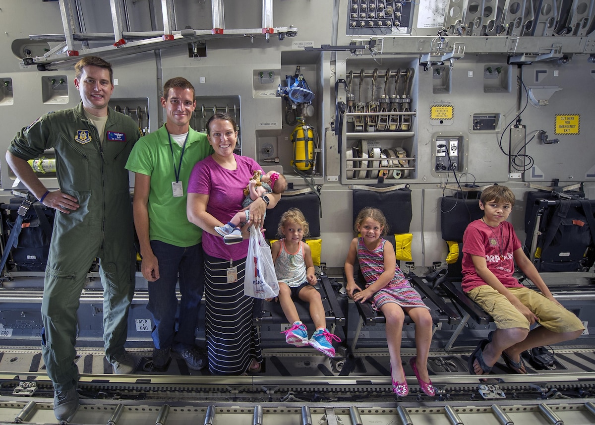 Capt. Ed Sutton, 701st Airlift Squadron, poses for a photo with his brother Andrew, a missionary, and his family in Grand Goave, Haiti during a Denton Cargo humanitarian mission.  Andrew, his wife Angie, and their three daughters live, work and serve with Hands and Feet Children’s Village in Grand Goave, Haiti where they provide hope and care for 34 children ranging from ages 18 months to 20 years old. (U.S. Air Force photo by Senior Airman Tom Brading)