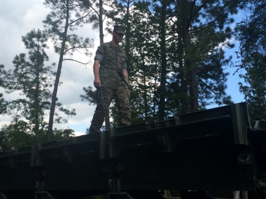 On May 4, 2016 Second Lieutenant Nicholas Downey, a Marine attached to Combat Engineer Officer course 5-16 (CEO 5-16); walks across and gains familiarization with the Medium Girder Bridge.  Students with CEO 5-16 were given classes on the design, construction, and employment of Marine Corps bridges.

