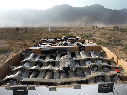 Contracted unexploded ordnance technicians finish capping in a 5-ton demo shot outside of Bagram Airfield, Afghanistan.