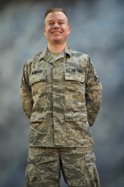 Senior Airman Chadwick McIntosh, 910th Inspector General inspections team member, poses for a photo in the photo studio here, March 6, 2016. McIntosh committed to a healthier lifestyle and shed 80 pounds in order to pass his Fit to Fight test and rejoin the Air Force Reserve. (U.S. Air Force photo/Tech. Sgt. James Brock)